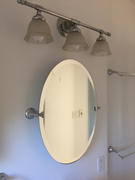pedestal sink, oval mirror light fixture. Victoria City, Victoria