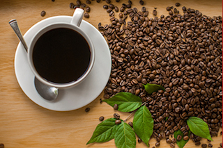 Cup of coffee with coffee beans