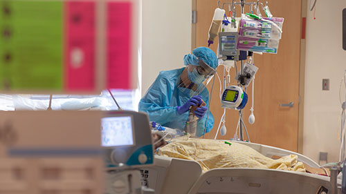 Nurse in full PPE working in the COVID-19 ward
