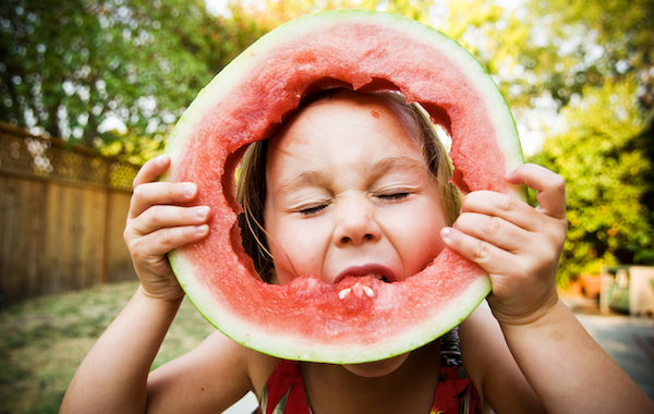 little girl eating watermelon messy