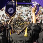 Photo of graduates in caps and gowns from the back. On June 15, 2019, the University of Washington honored more than 6,000 graduates in the 144th Annual Commencement Exercises at Husky Stadium. Nearly 13,795 UW degrees were conferred at the Seattle campus in June. (Photo by Mark Stone)