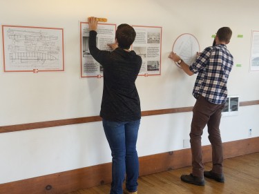 Samuel Howes and Valerie Kendall (class of 2019) hanging signs at CWB. Photo courtesy of Amy Gorton.