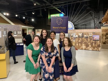 Celebrating the opening of "Hero’s Feast: Building Community Through Dungeons and Dragons" at RHM with previous students of the Samson's history collections lab students L-R, Front: Dorothy Svgdik, Allison Moore, Elaine Carter L-R, Back: Sarah Samson, Steffi Morrison, Nicole Jarvis
