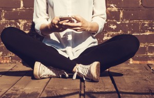 Girl sitting and texting