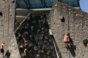 University of Washington students rock climbing near the Husky Stadium.