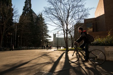SStudents and visitors walking and biking around the Quad.