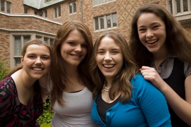 Four smiling students.