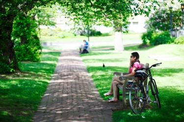 Student on cellphone in the Quad.