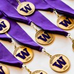 Husky 100 medals laid on a table for the 2019 Husky 100 celebration event