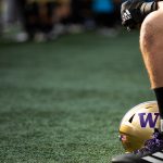 Football player sitting on the sidelines