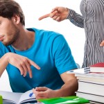 Teacher wagging her finger at a student