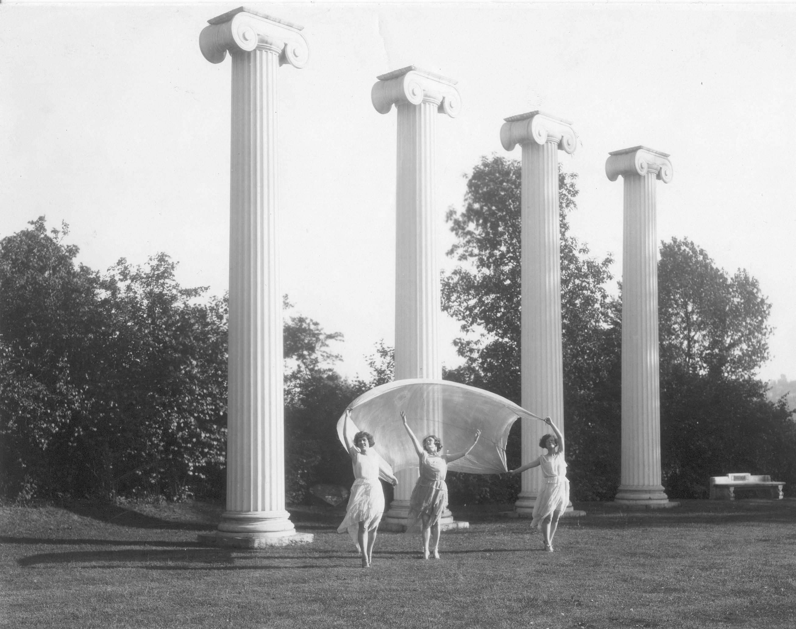 1920's Dancers at Slyvan Grove Three 1920's women dance in Sylvan Grove in front of the Four Columns