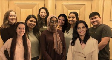 Group photo of nine members of Husky Experience Student Advisory Council