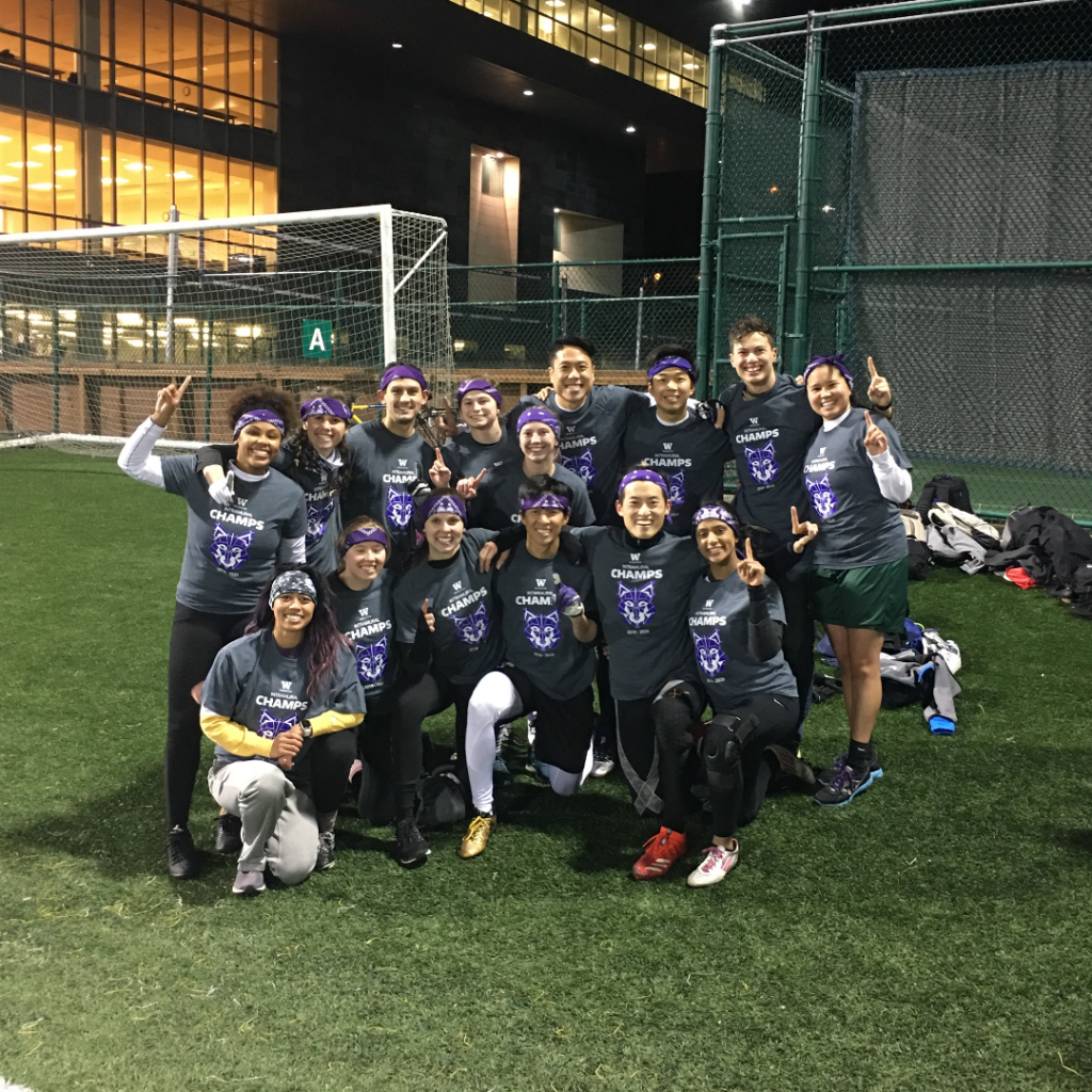 The autumn 2019 Intramural flag football champs are all smiles on the turf.