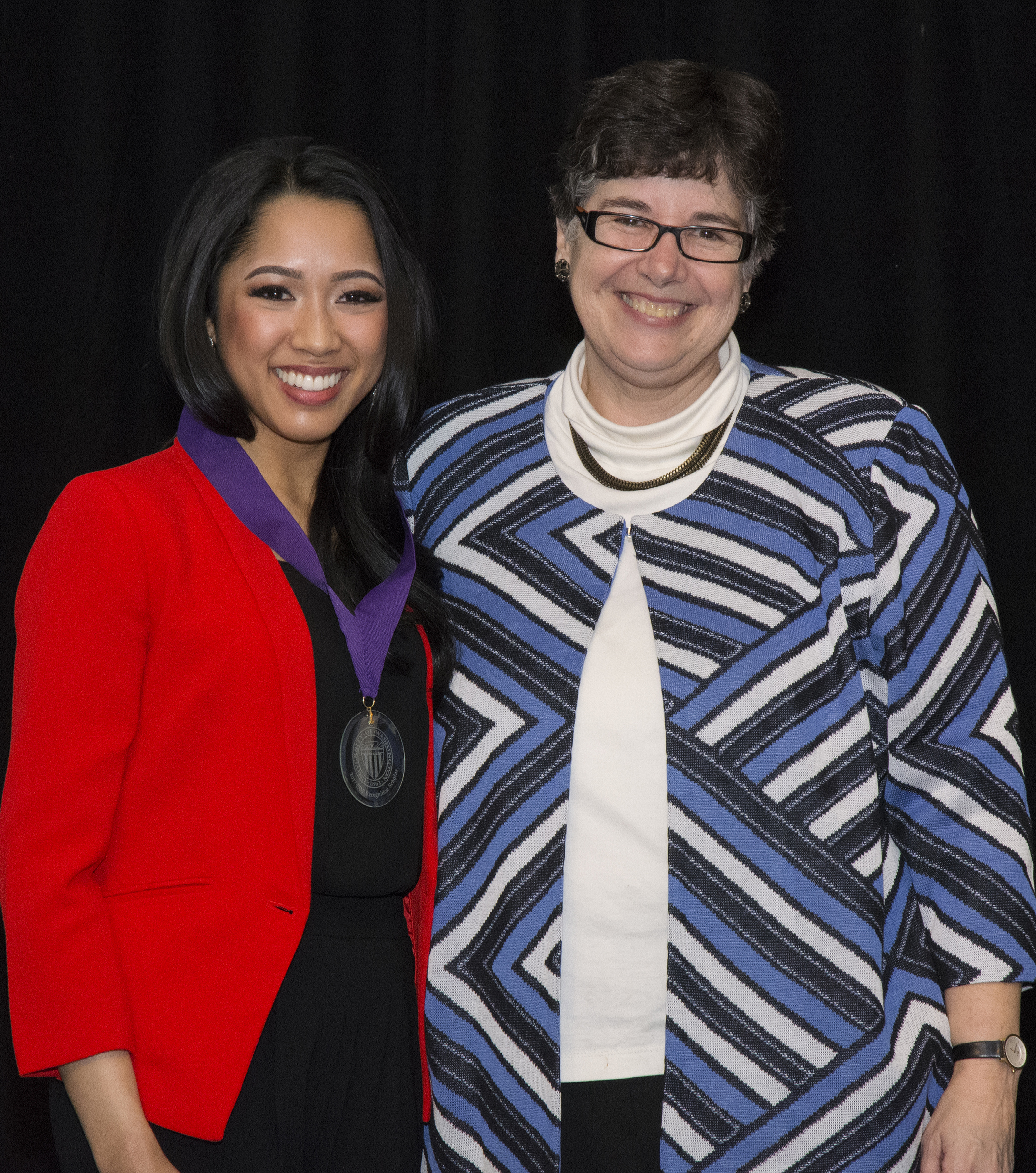UW President Ana Mari Cauce congratulates 2016 President's Achievement recipien, Ruben Reyes