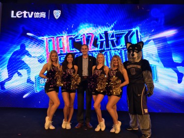 UW dancers and Harry the Husky with Pac-12 Commissioner Larry Scott at the announcement of a new agreement with China's Letv