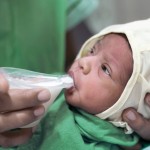 A baby drinks from the new cup