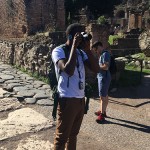 Student taking pictures in the Roman Forum.