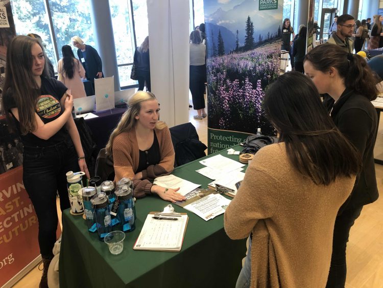 Photo of McKenzie Carlson and Rhyannon Hayes at tabling event.