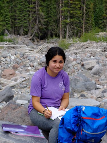 Photo of a student with her field journal.