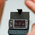 Person signing at smartphone