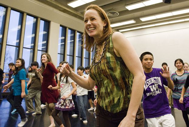 UW Dance Professor Juliet McMains leads a group of students from Amazing Grace Christian School in a lively dance. | Photo by Kathy Sauber