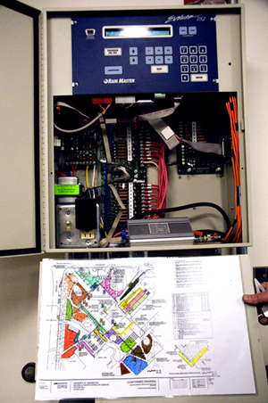 The campus standard network controller is above, with a color coded irrigation zone map. The controller uses Ethernet to connect to the irrigation office for remote monitoring and programming. The color coded map shows various zones comprised of dedicated sprinklers or drip irrigation to serve unique plant water requirements and microclimate variables. See below for more photos. | Photo by Mary Levin