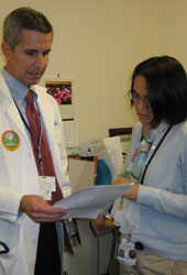 Bill Ellis, UW professor of urology, talks with lean expert Naomi Maxey about the U-FIT project.