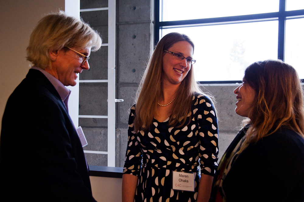 An invited guest talks with the Center for Commercializations Maren Ohaks, associate director of New Ventures, and Linden Rhoads, UW vice provost for commercialization.
