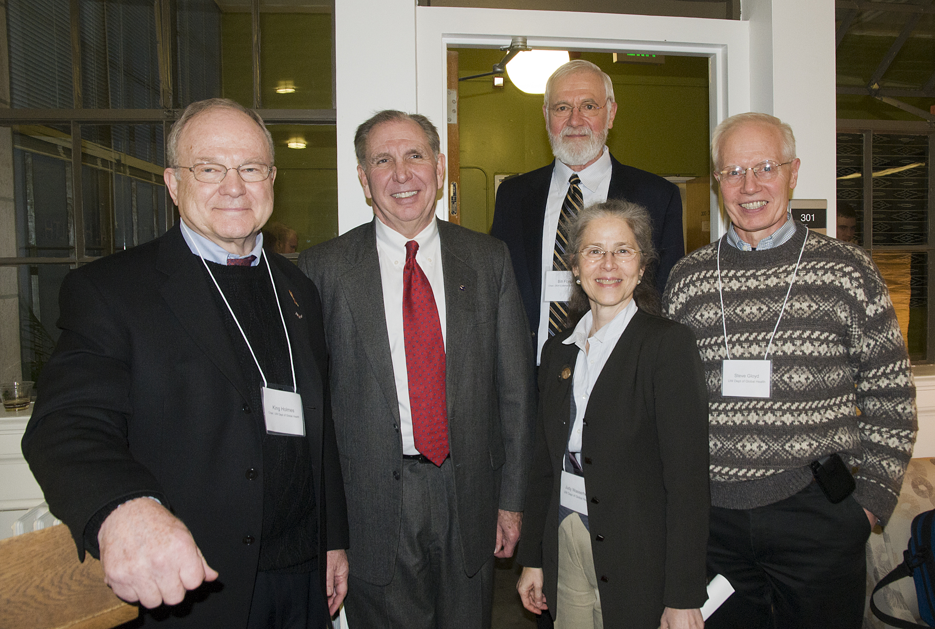 From left to right: Global Health Department Chair King Holmes, UW President Michael Young, External Advisory Chair William F. Foege, Global Health Department Vice Chair Judith Wasserheit, and Department Associate Chair for Education and Curriculum Stephen Gloyd celebrate the new global health student space on campus.