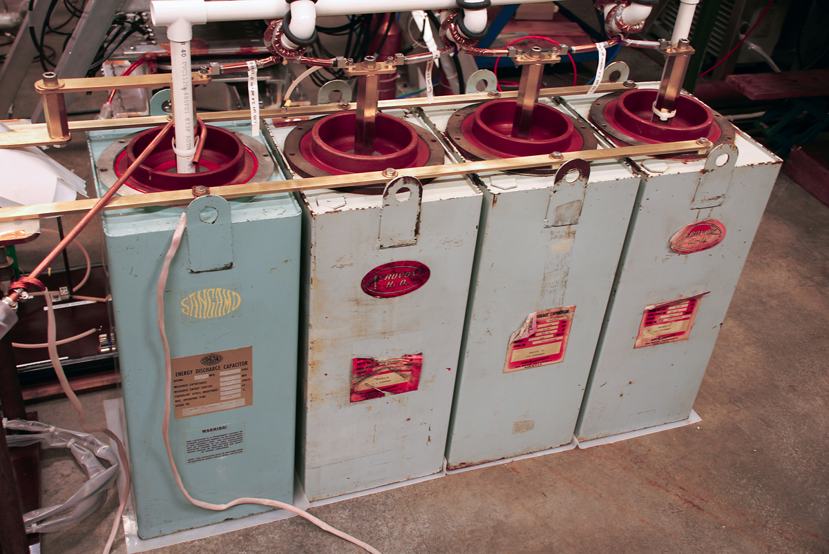 Four capacitors supply up to 10,000 volts to separate the xenon electrons from their nuclei, creating an electrically charged plasma.