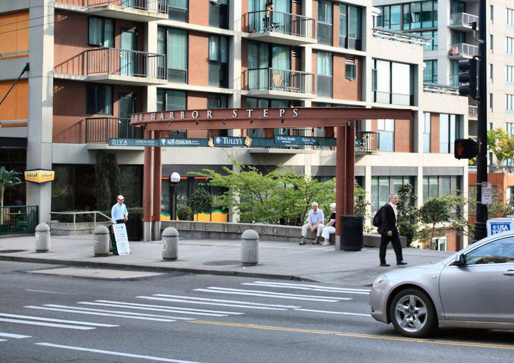 Pedestrians stroll the area around Harbor Steps in downtown Seattle.
