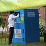 Student donates clothing at a collection site outside Terry Hall