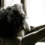 child looks out of window