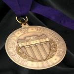 Golden medal for awards of excellence on purple ribbon
