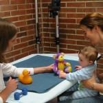 One year old baby with experimenters
