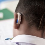 Student wears hearing aid in class