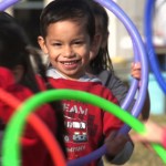 children playing with hula hoop