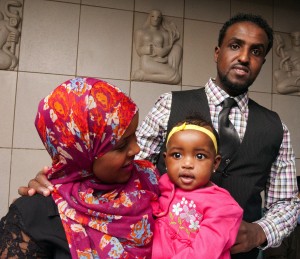 Graduating medical student Anisa Ibrahim, at Match Day with her husband and baby daughter, will train as a pediatrician.