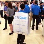 UW grad student Michael Lee advertises his team in the business plan competition.