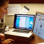 A young woman working with a computer.