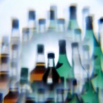 Wine and hard liquor bottles photographed through a multiprism filter.