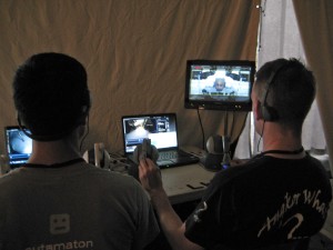 UW students Hawkeye King, left, and Lee White operate the robot seen in “Ender’s Game.” It takes two people to move the robot’s four arms. The students watched several cameras and used nonverbal signals to communicate with each other during the shoot.