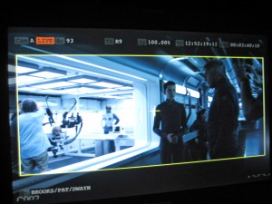 At right, actors Asa Butterfield and Harrison Ford during the filming of a scene from “Ender’s Game.” The UW robot can be seen on the left.