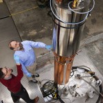 Physicists examine components of the axion detector at the University of Washington.