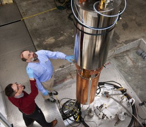 Physicists examine components of the axion detector at the University of Washington.