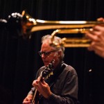 Guitarist and trumpet player rehearse