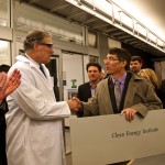 Gov. Jay Inslee (center) shakes hands with Dan Schwartz, director of the new Clean Energy Institute, with UW President Michael Young (left).