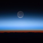 The sun is just below the horizon in this photo and creates an orange-red glow above the Earth's surface, which is the troposphere, or lowest layer of the atmosphere. The tropopause is the brown line along the upper edge of the troposphere. Above both are the stratosphere, higher atmospheric layers, and the blackness of space.