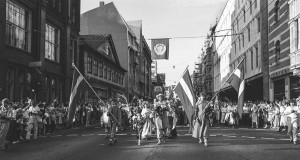 A black and white photo of a Baltica Folklore Festival procession in Riga, Latvia in July 1988.
